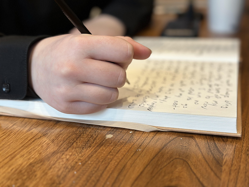 Person writing in a journal