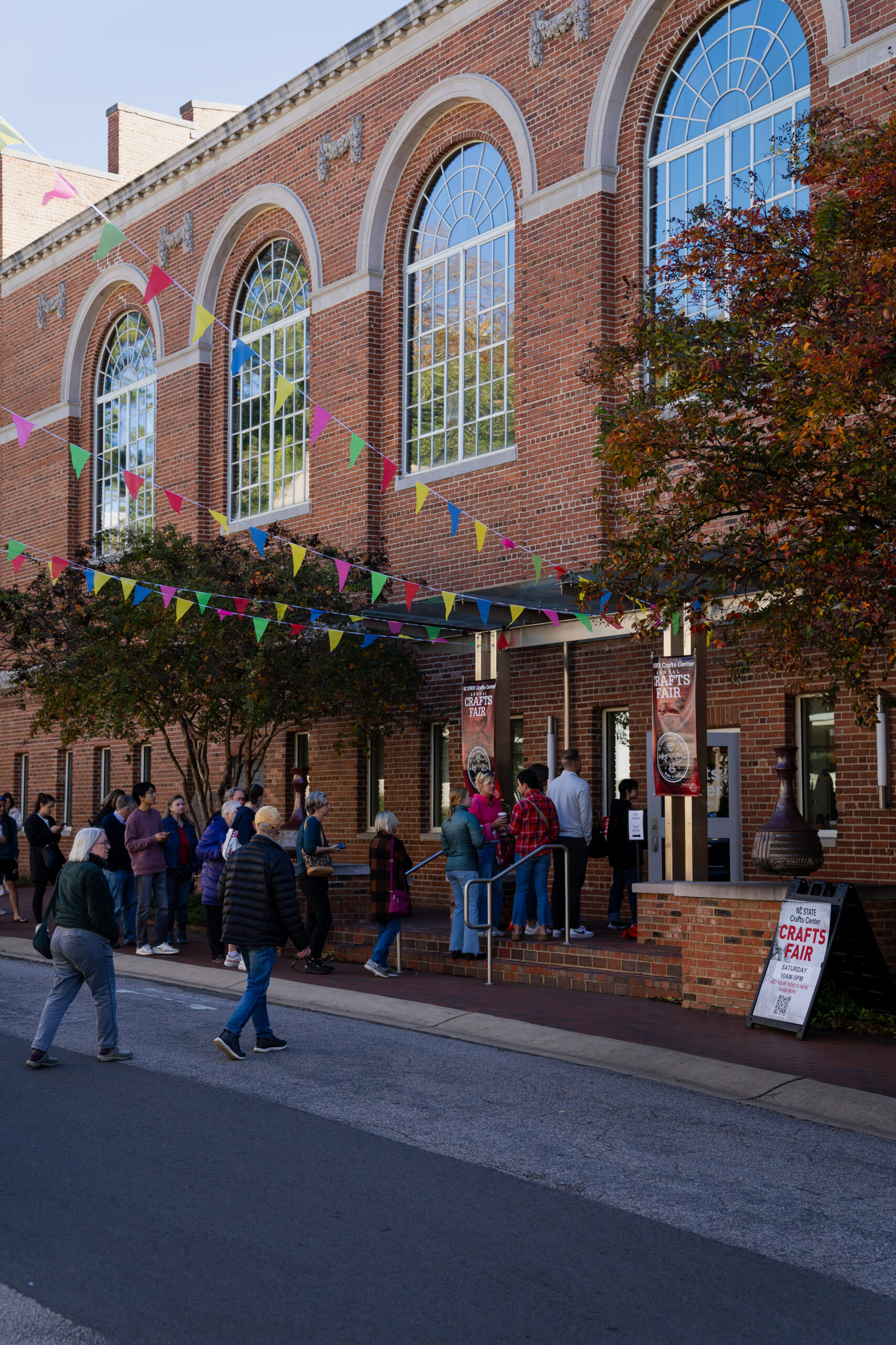 Visitors streaming into the front door of the annual Crafts Fair. 