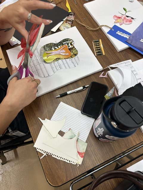 A student creates a collage art project