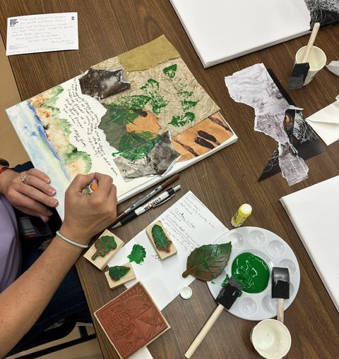 A student creates collage art.