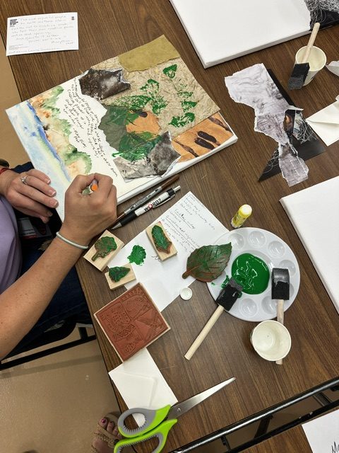 A student creates collage art.